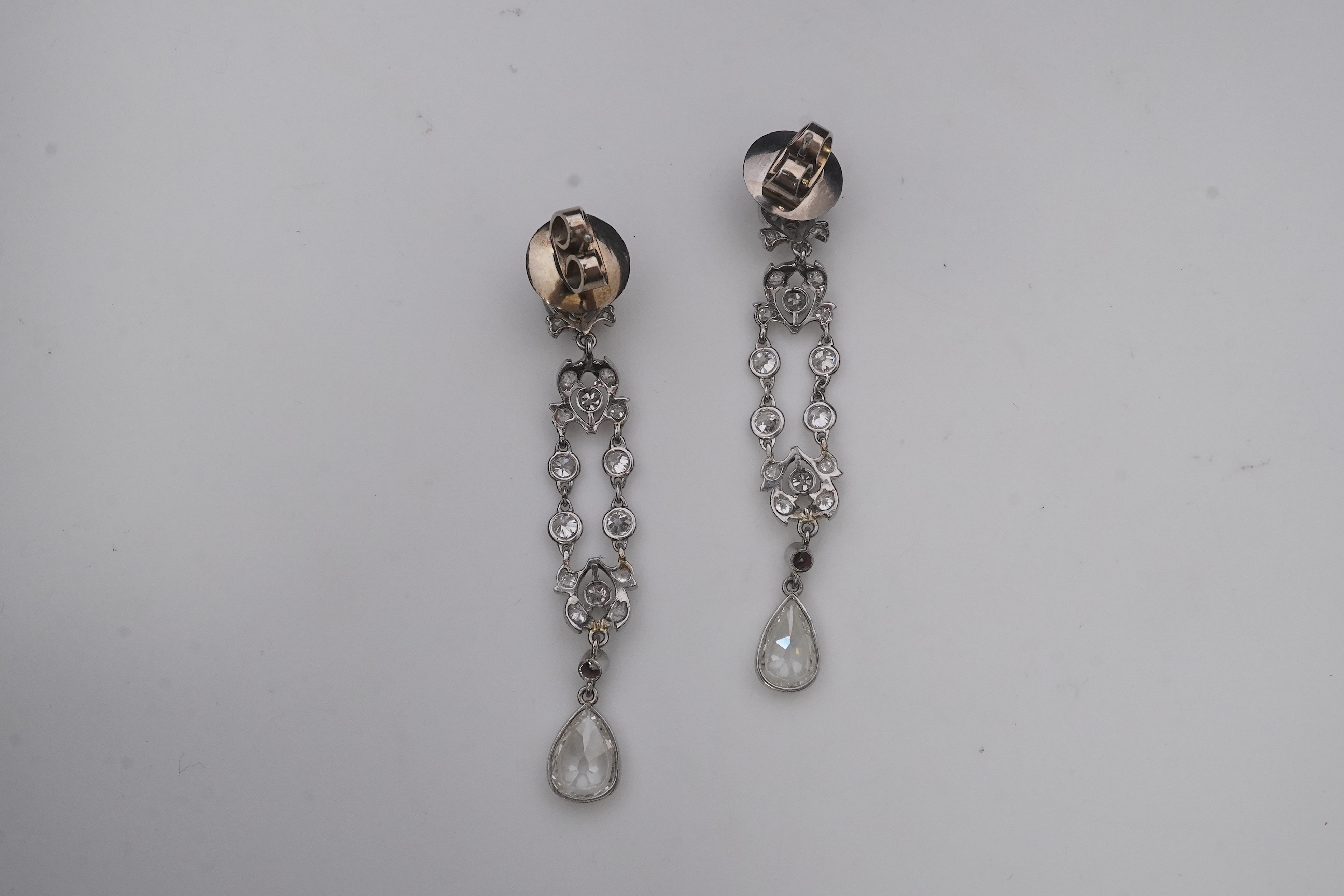 A pair of diamond earrings, early 20th century composite